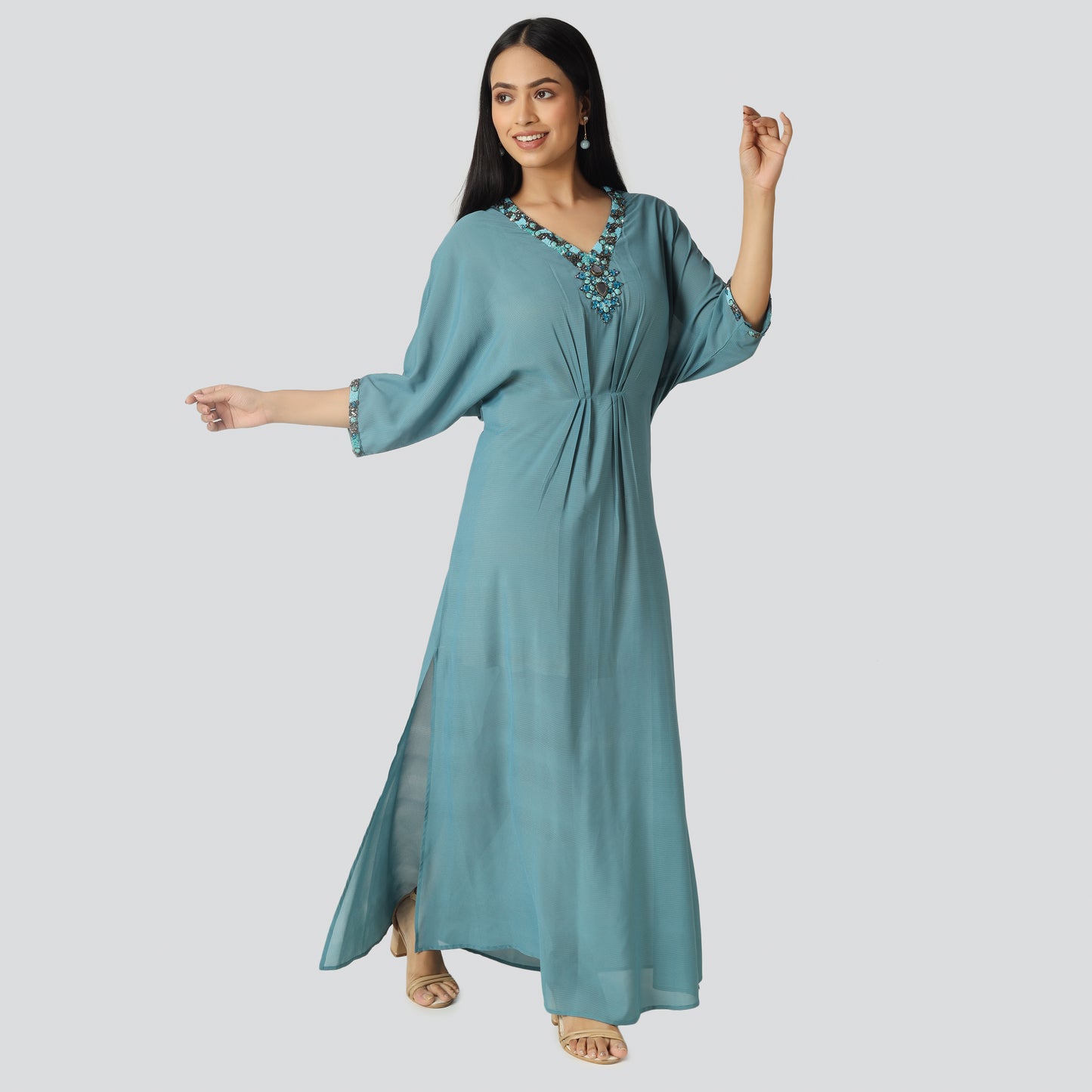Light blue wearing lady and smiling