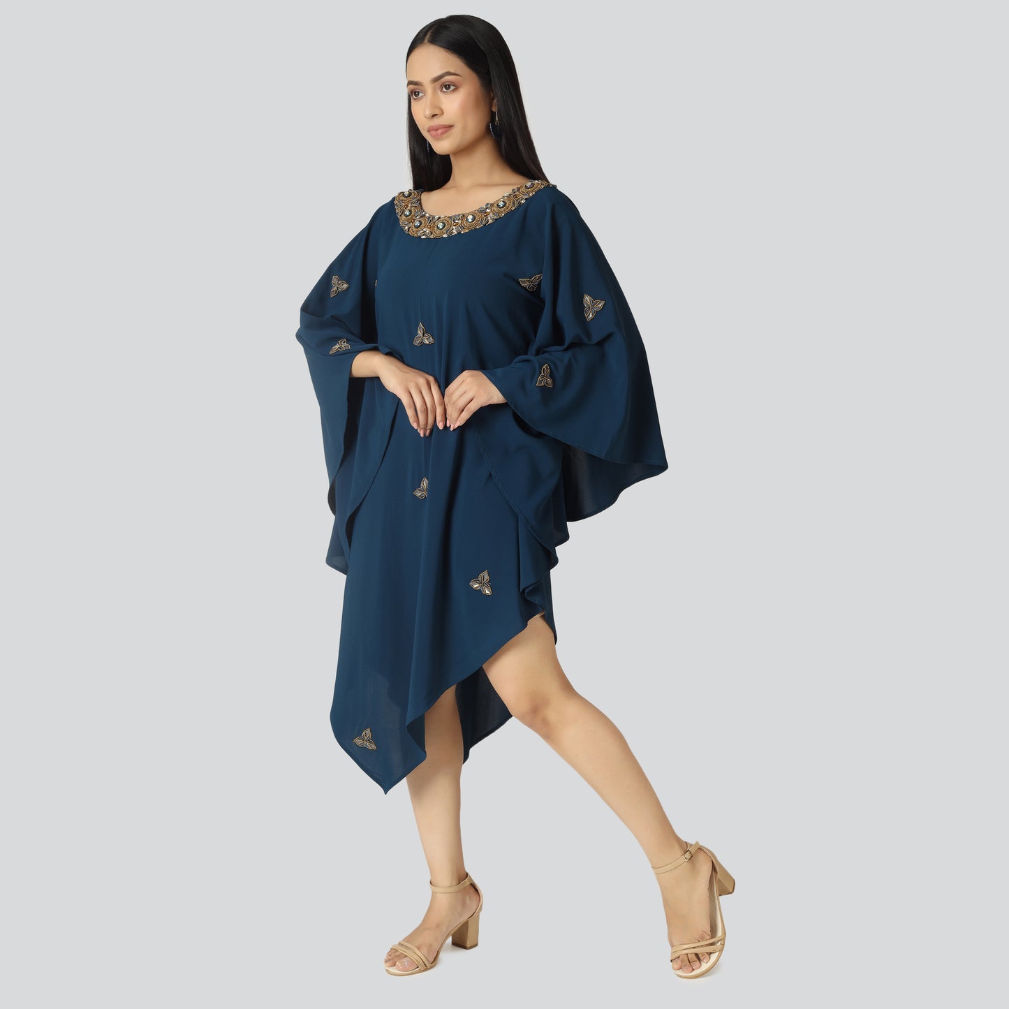 A girl in knee length kaftan dress