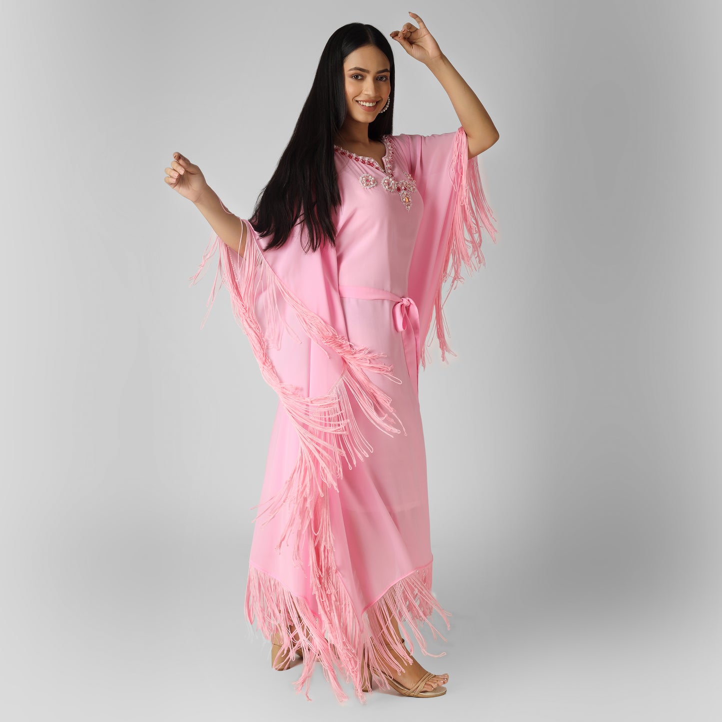 Smiling woman in pink color stylish dress