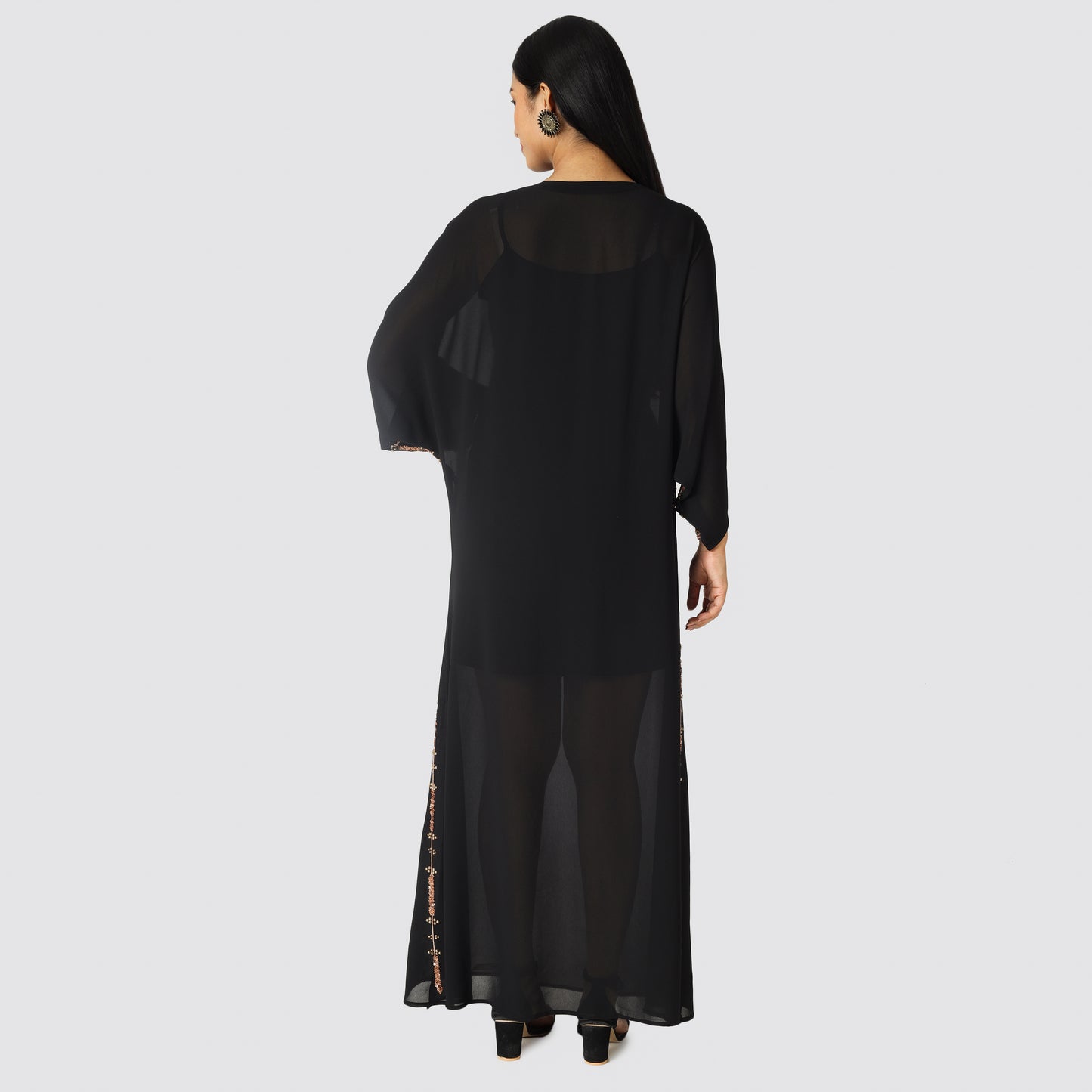 Woman wearing long black color dress