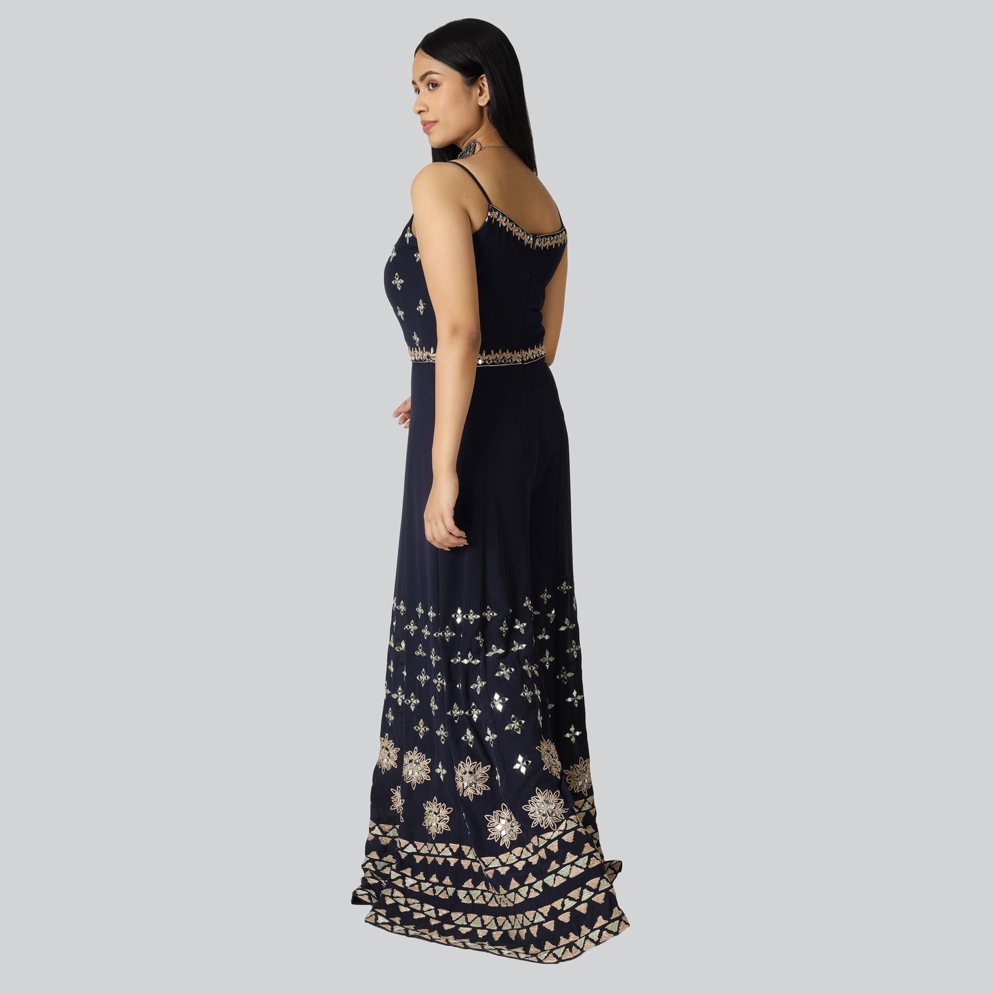 Slive less navy blue jumpsuit wearing lady