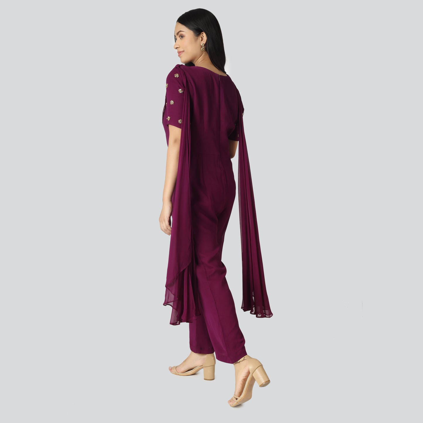 An Indian girl wearing Indo Western purple jumpsuit