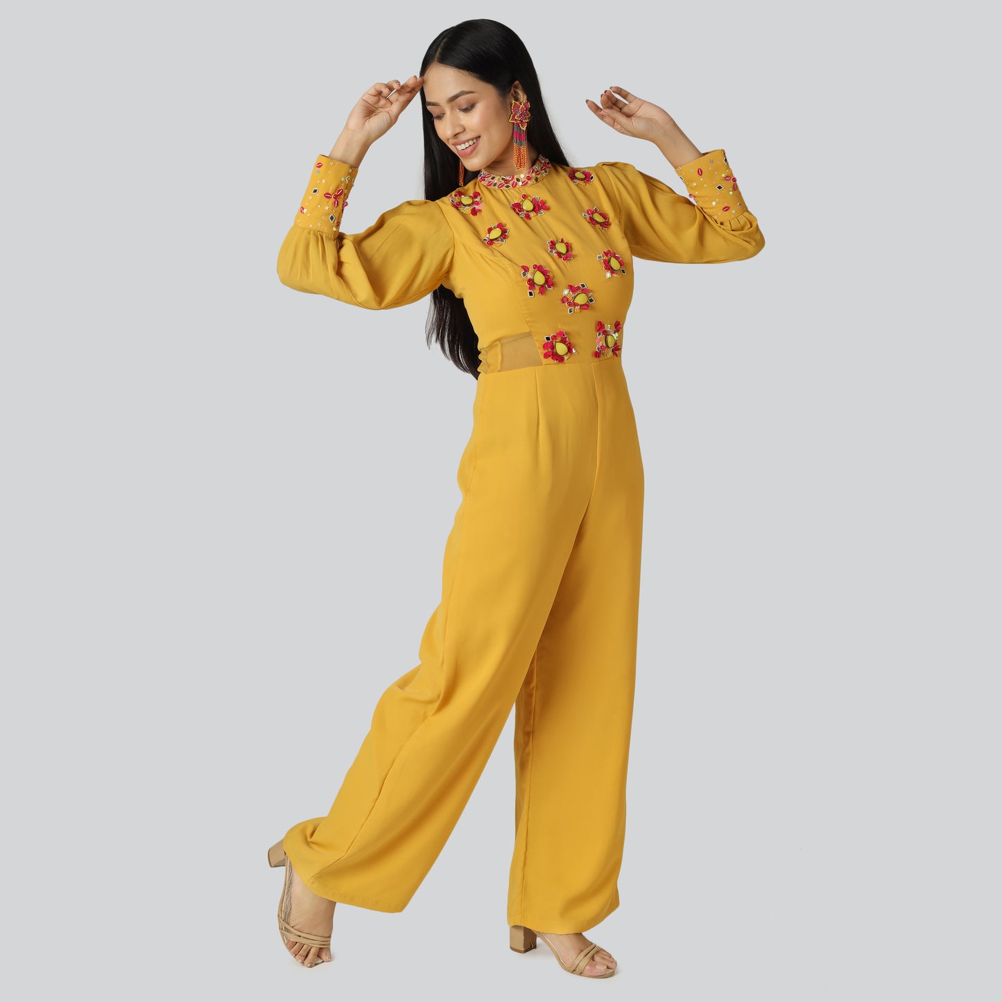 A smiling girl wearing mustard clothes