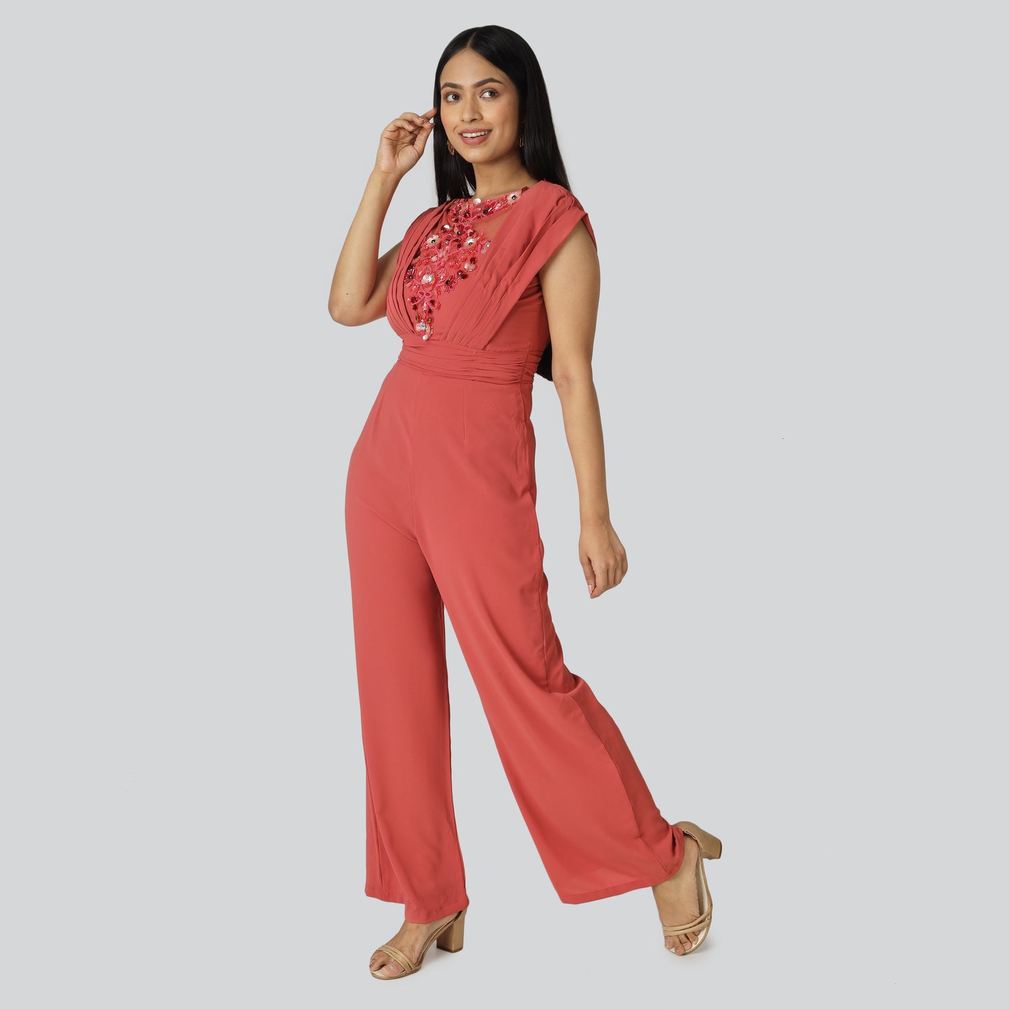 A girl wearing rust georgette dress