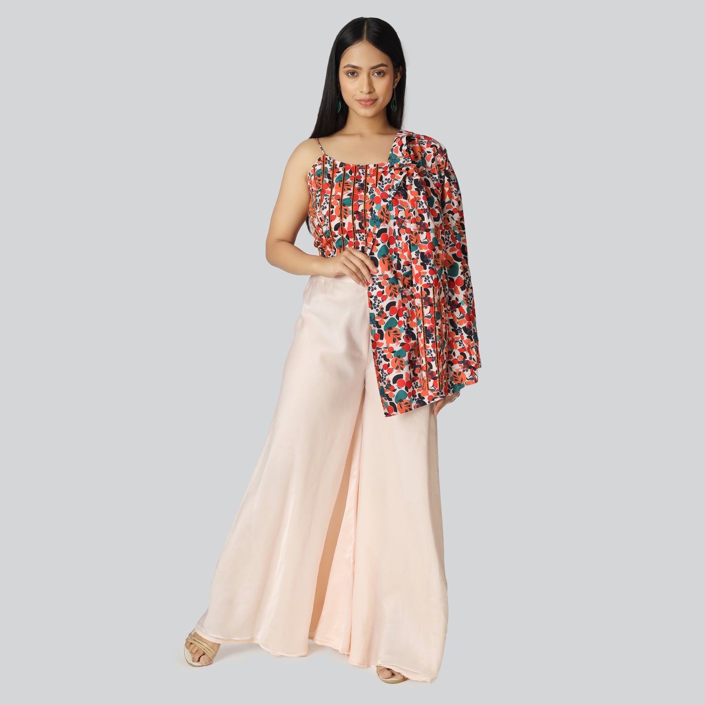 A girl in colorful top and creamy palazzo