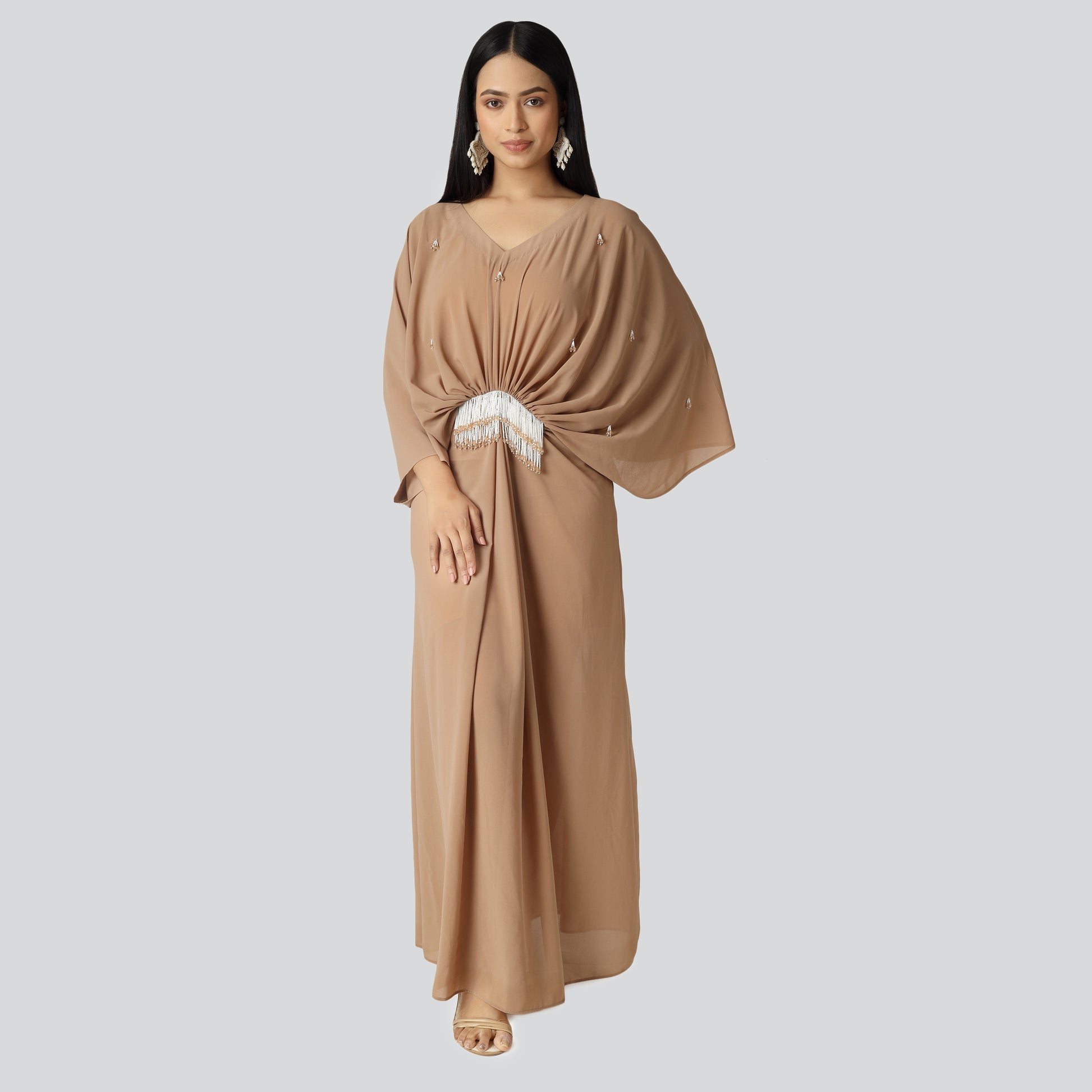 Young woman wearing brown color dress