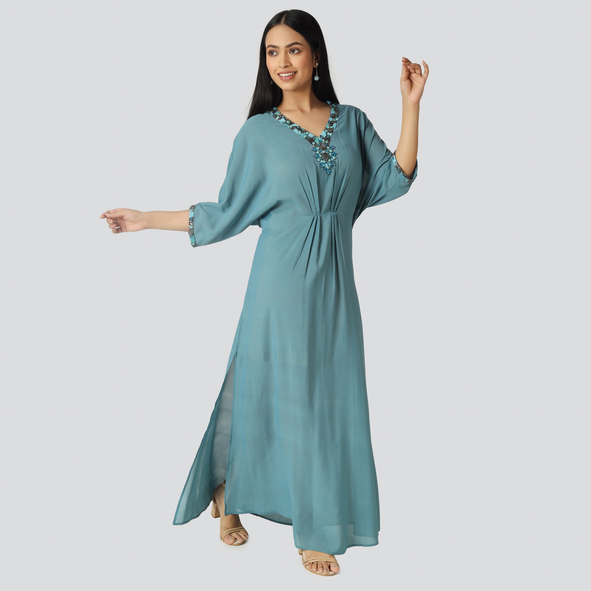 Light blue wearing lady and smiling