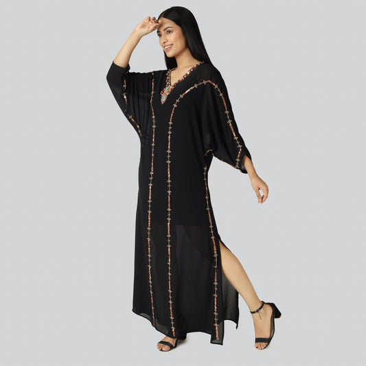 Woman in black color kaftan dress