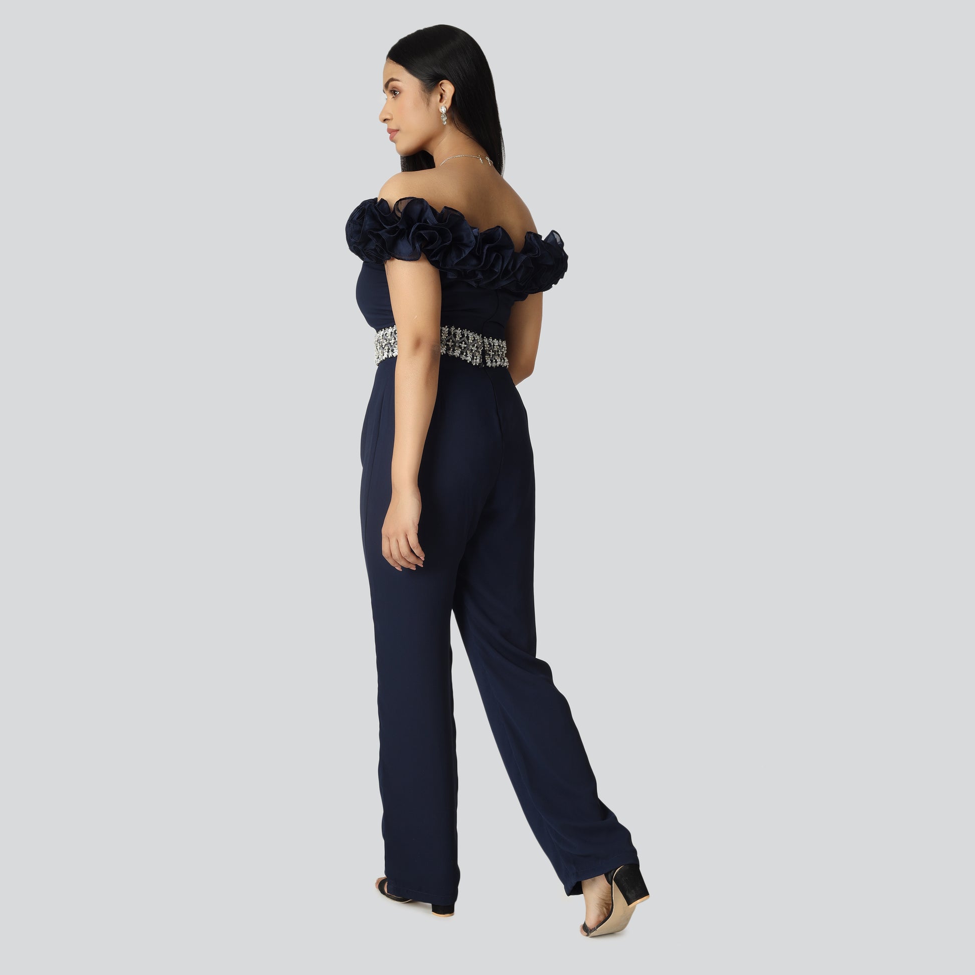 Girl wearing off shoulder navy blue jumpsuit dress