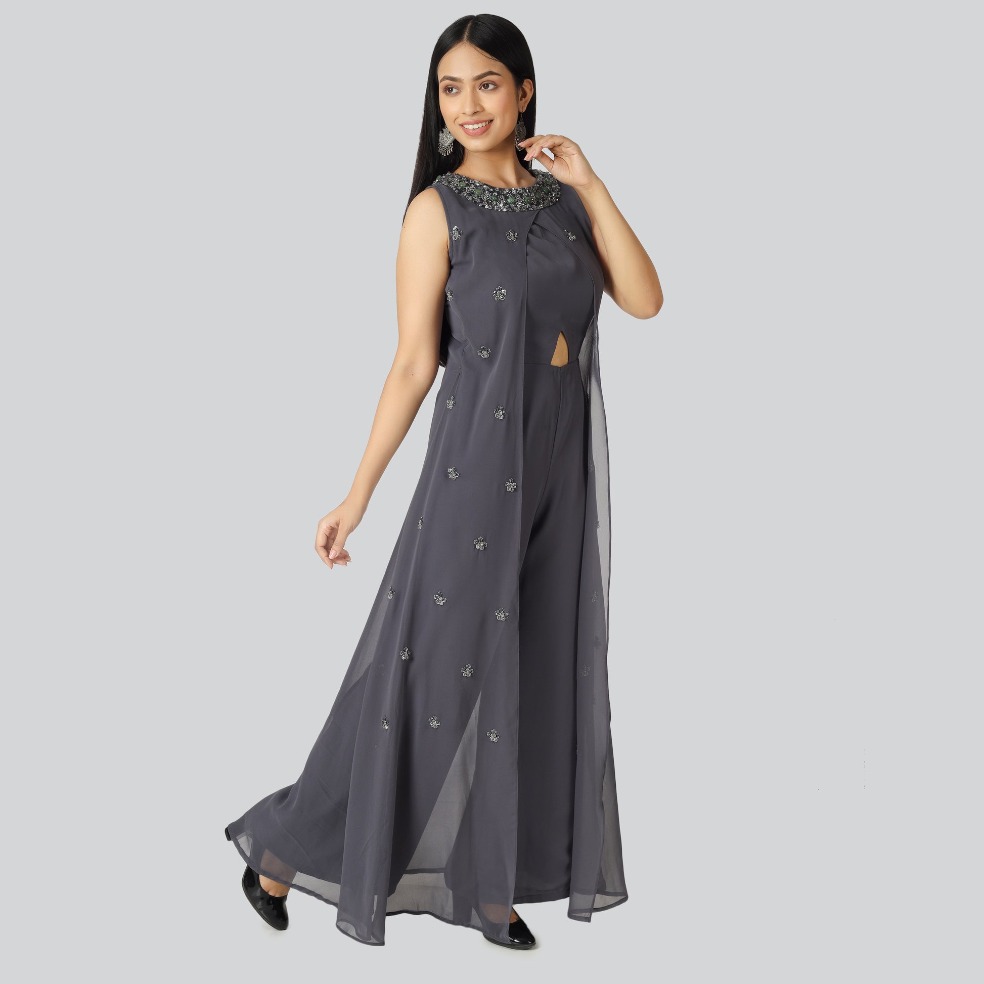 Dark grey jumpsuit wearing lady and smiling
