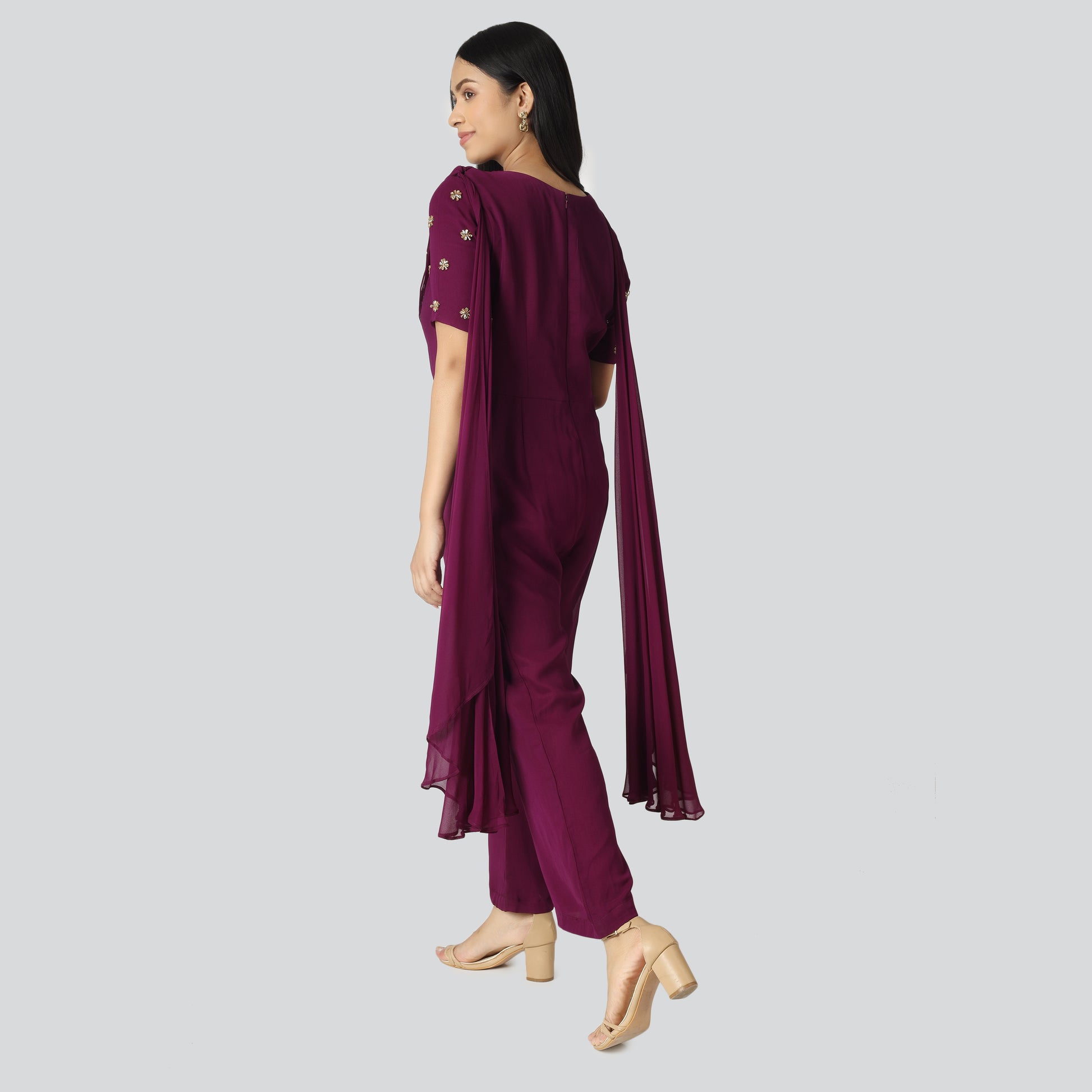 An Indian girl wearing Indo Western purple jumpsuit 