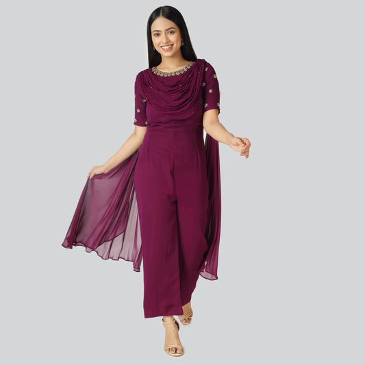 Smiling girl wearing purple jumpsuit