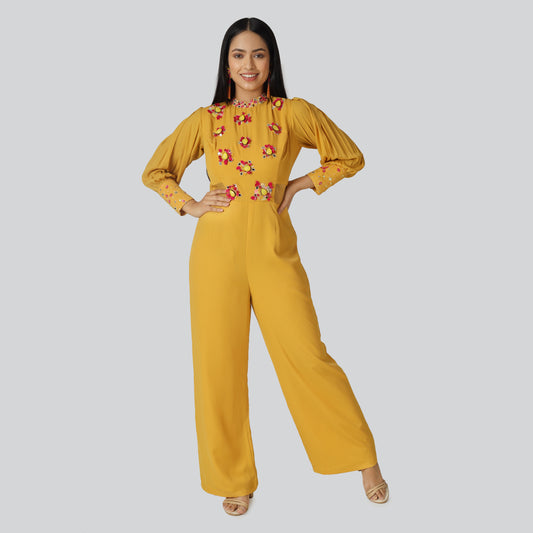 A smiling girl wearing mustard color dress