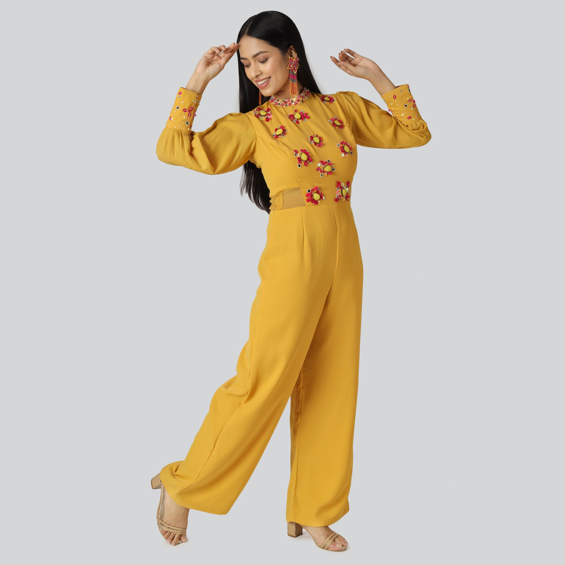 A smiling girl wearing mustard clothes 