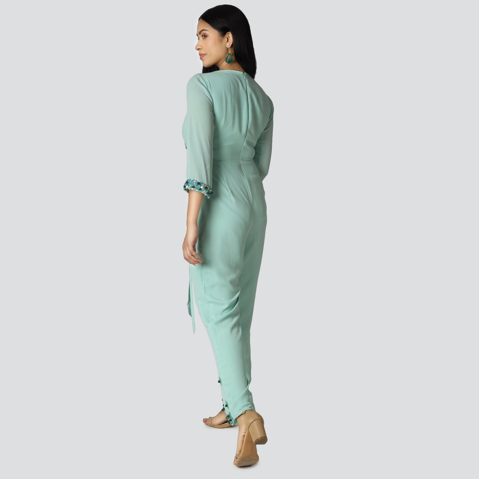 Sea green achkan style jumpsuit wearing girl