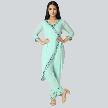 A girl wearing light green achkan style jumpsuit