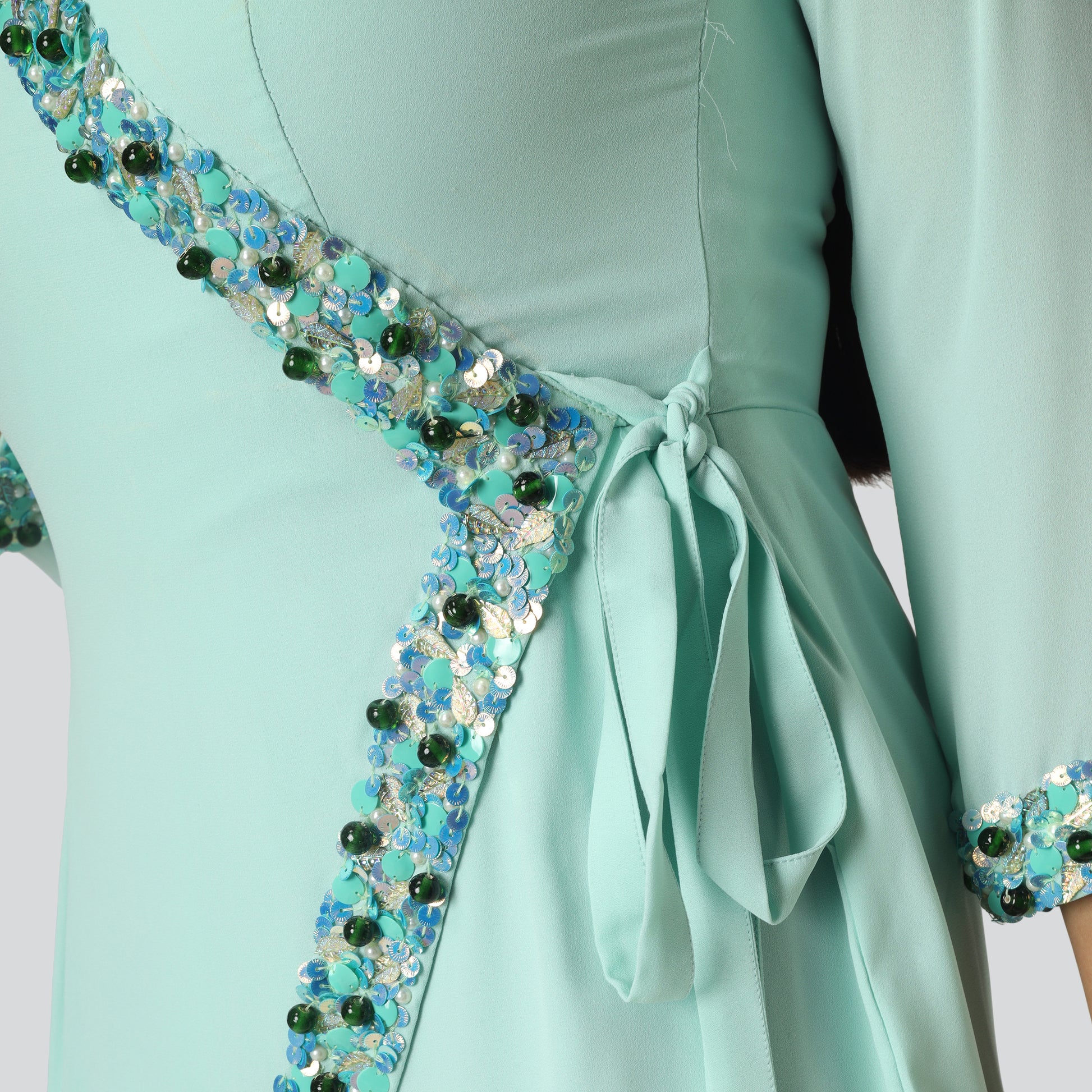 Sea green achkan style suit with belt close side look