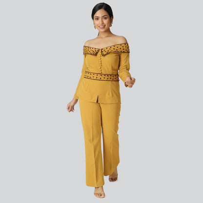 Smiling girl wearing yellow pant suit