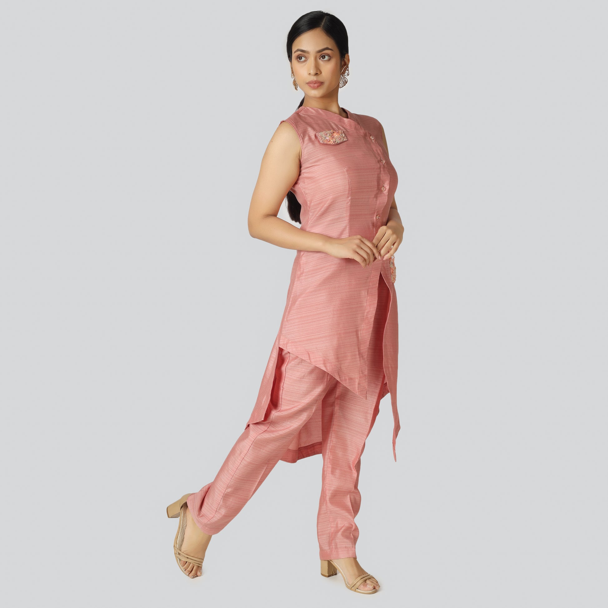A girl wearing stylish pink clothes